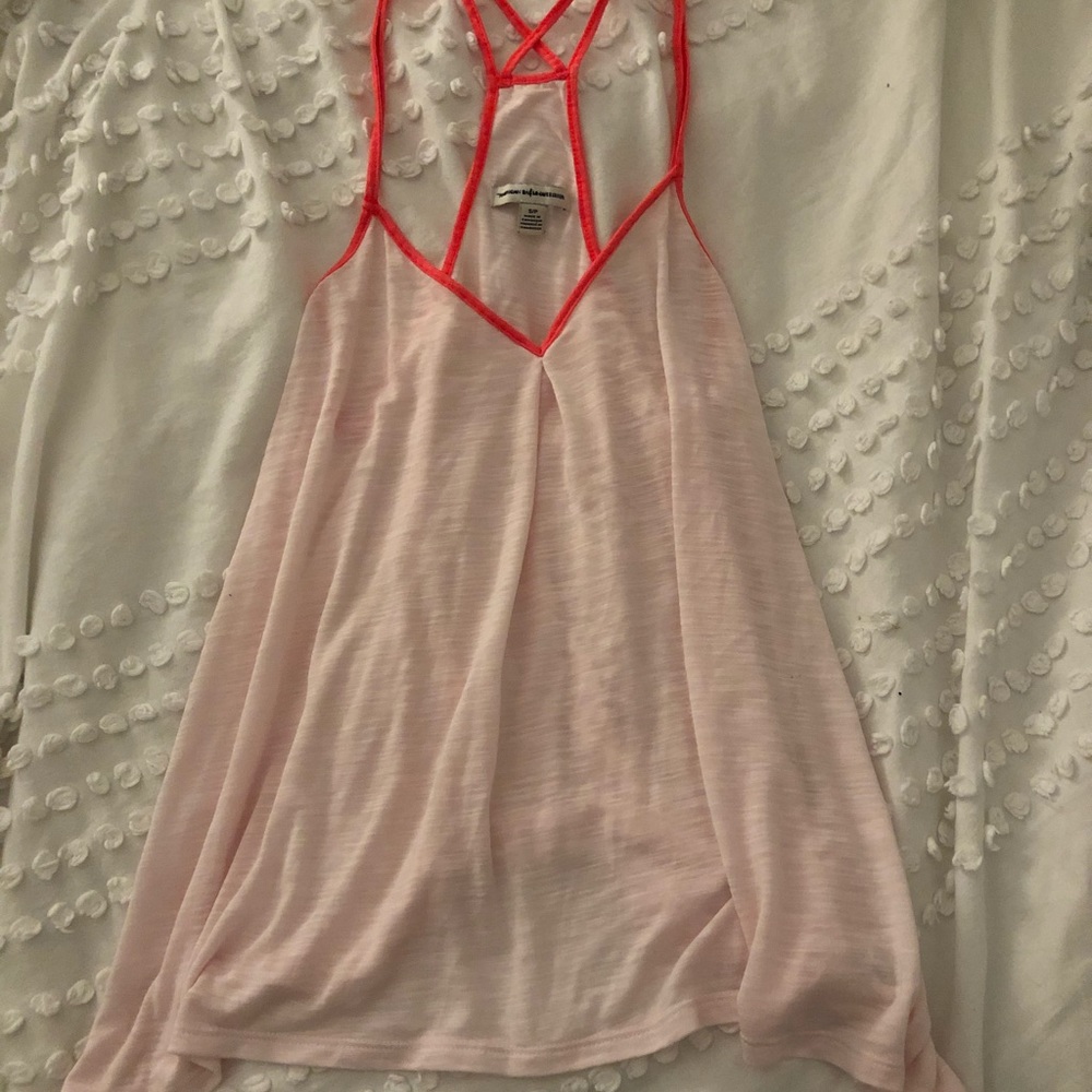 Light pink tank top crisscrossed back